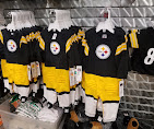 Black and gold jerseys on display racks
