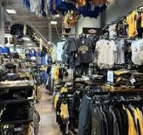 Racks of black and gold fan gear inside the store