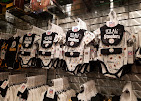 Wall of jerseys hanging in the shop