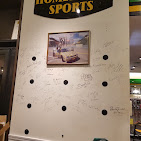 Hometowne Sports signage above an in-store display wall