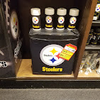 Novelty drinkware and gift sets on a shelf